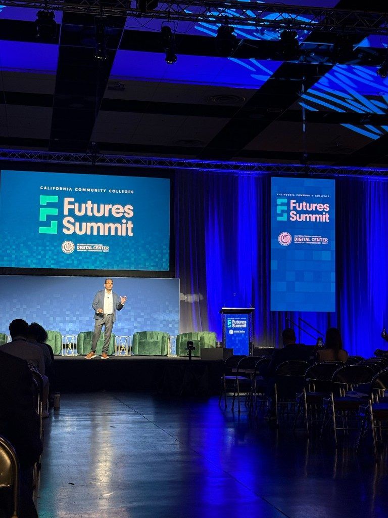 Kiran Kodithala on the Futures Summit 2026 stage, with the full Futures Summit + CCC Digital Center branding behind him.